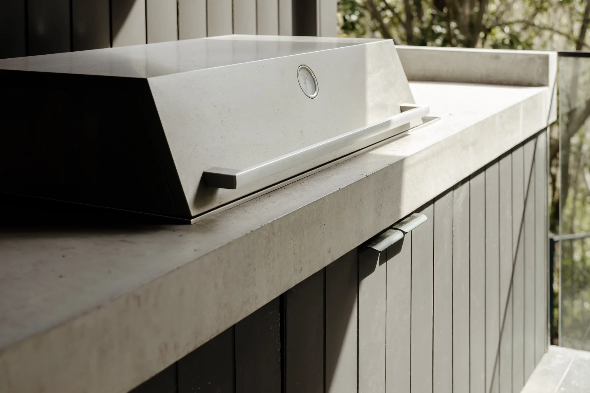 Completed poured-in-place outdoor kitchen with integrated concrete benchtop