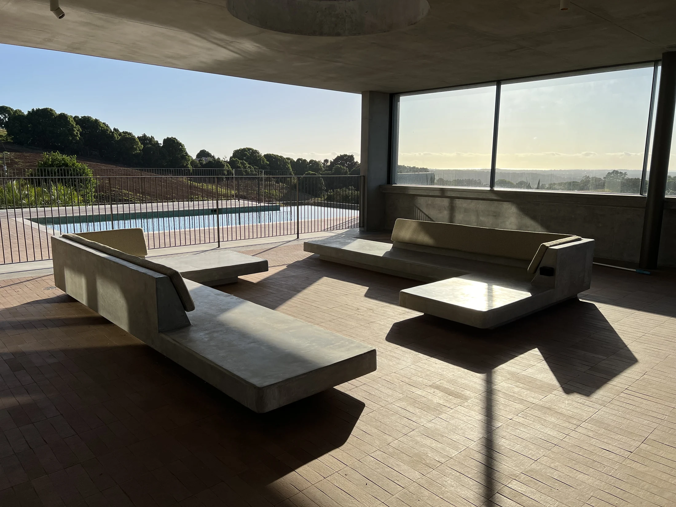 Completed integrated concrete seating within a landscaped outdoor room