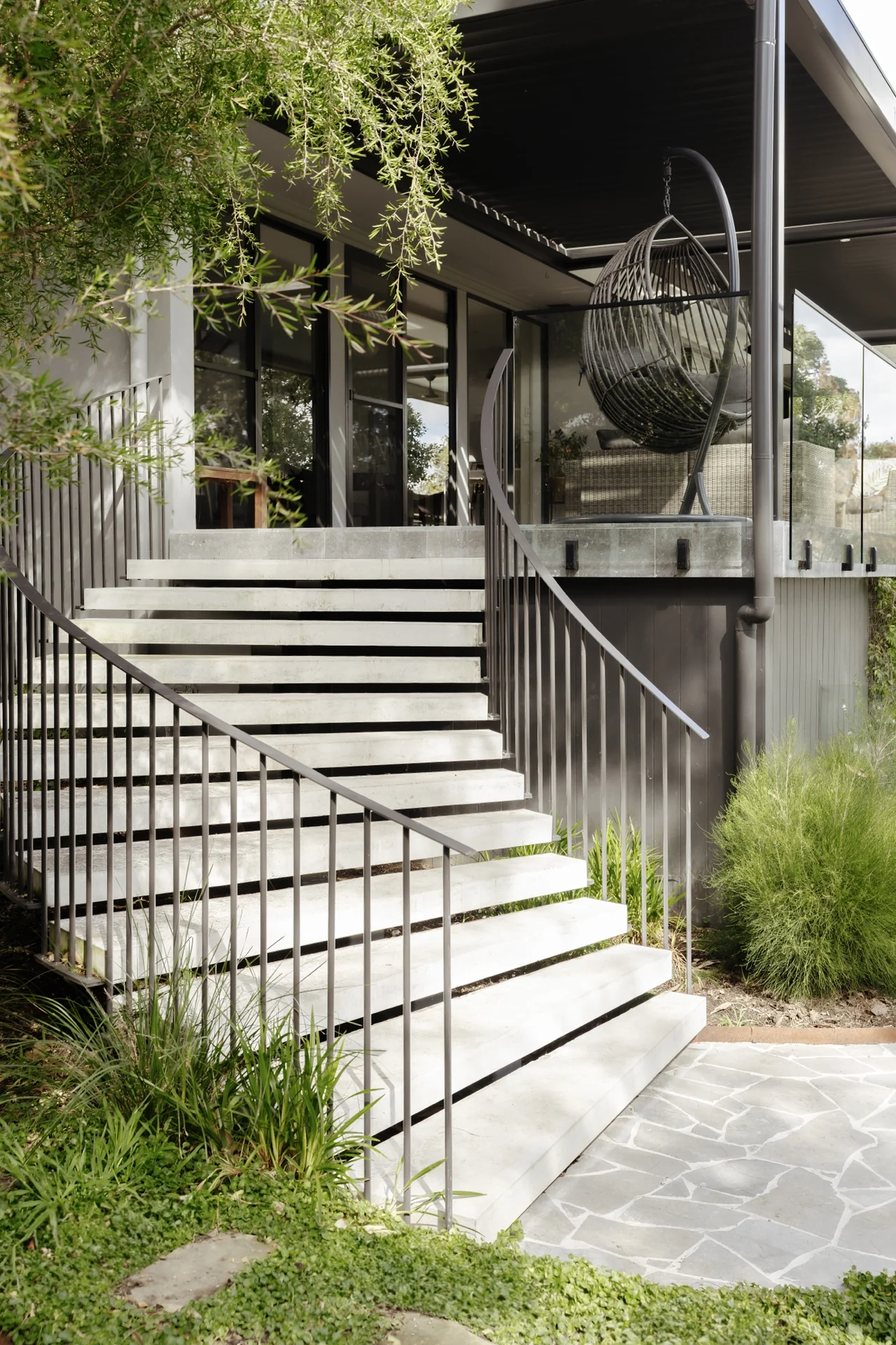 Completed floating concrete stair flight with precise edges
